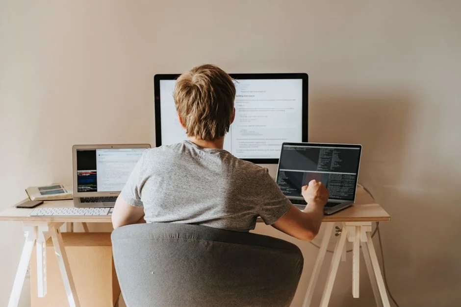 why-choose-us Group of designers collaborating in modern office space with computer.